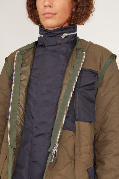 Sacai Coats Rip Stop Quilted Coat in Khaki/Dark Navy Sacai Rip Stop Quilted Coat in Khaki/Dark Navy