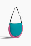 JW Anderson Shoulder Bags The Bumper Moon Shoulder Bag in Turquoise/Bubblegum Pink JW Anderson The Bumper Moon Shoulder Bag in Turquoise/Bubblegum Pink